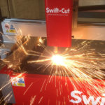 Swift-Cut Pro CNC plasma cutting table in action with sparks